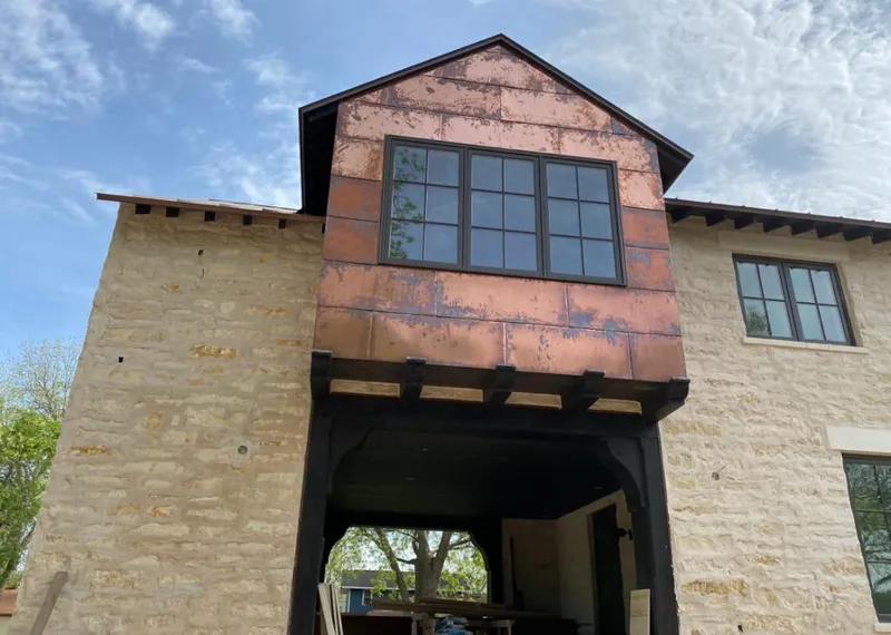 Copper metal panel facade on a stone building for Metal Roof Coating in Gig Harbor